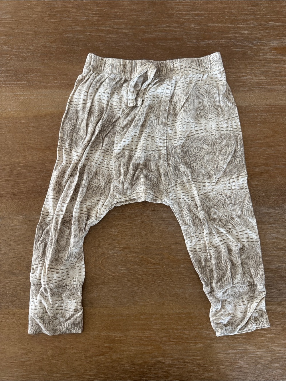 Kate Quinn gator print panda pants